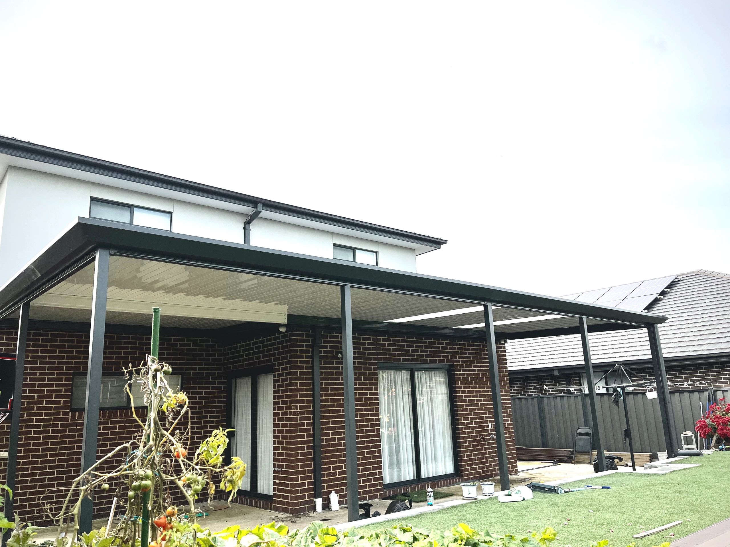 Black framed pergola patio cover