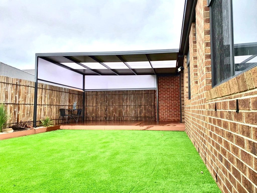 Pergola with translucent roof panels terracotta paving