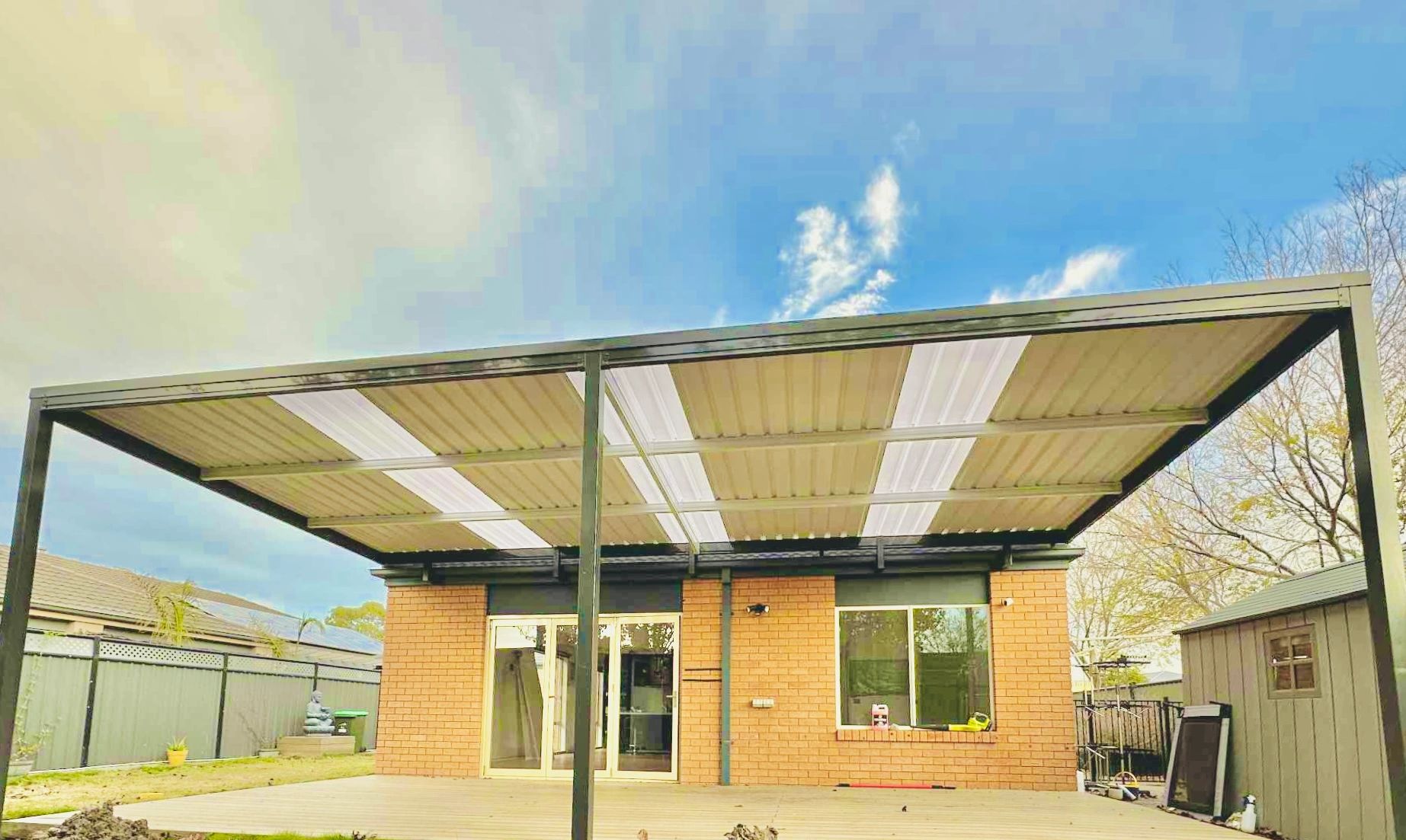 Pergola with yellow and white polycarbonate panels